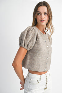 Side profile of Shanty Sweater in beige knit showing soft texture and feminine puff sleeves.