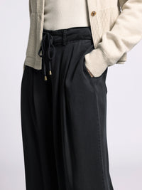 Close-up detail of Gloria Wide Leg Pants showing adjustable drawstring waist and soft drape fabric.