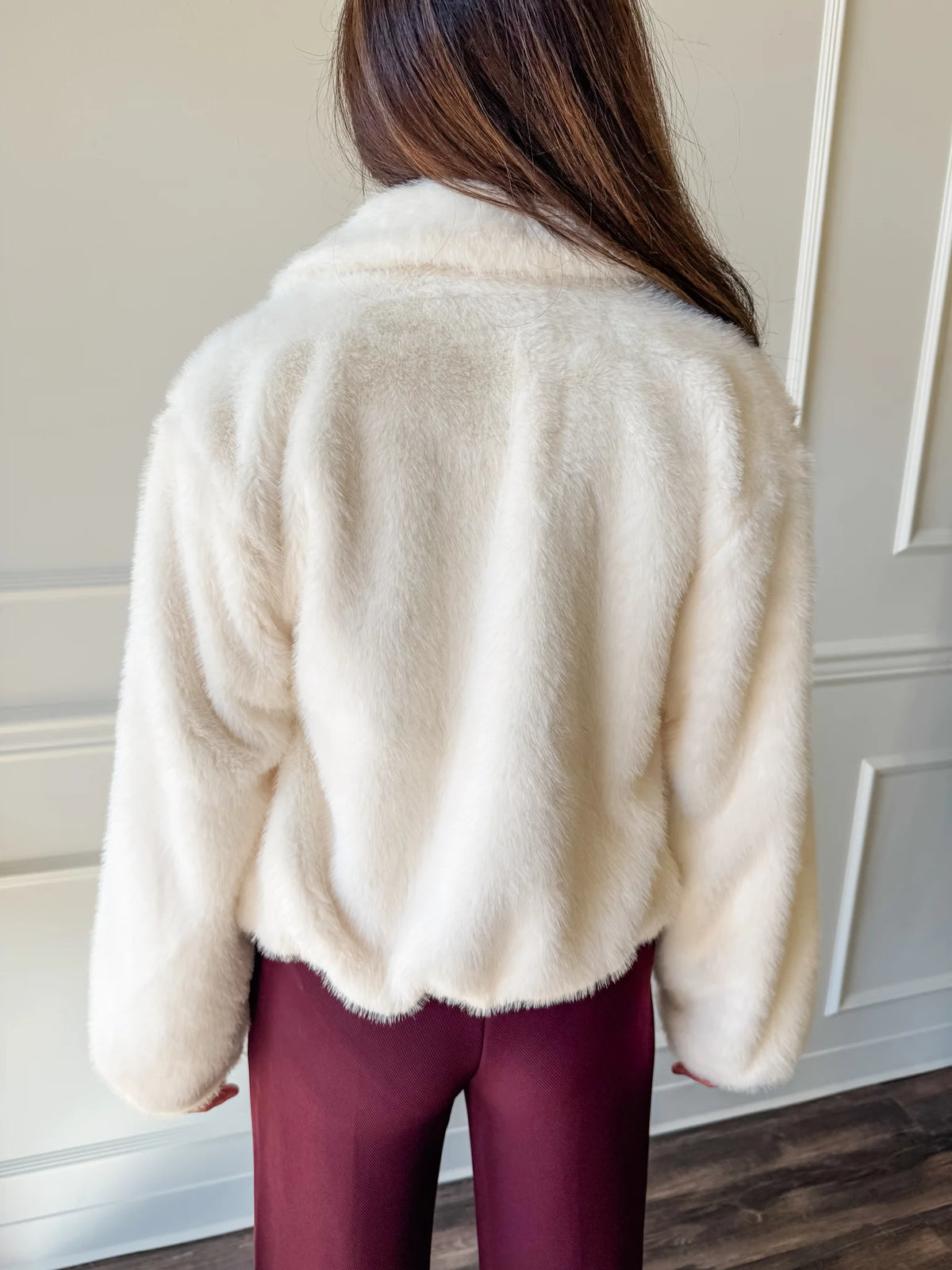 Back view of Steve Madden Evanie faux fur coat showing soft luxurious texture and cropped fit.