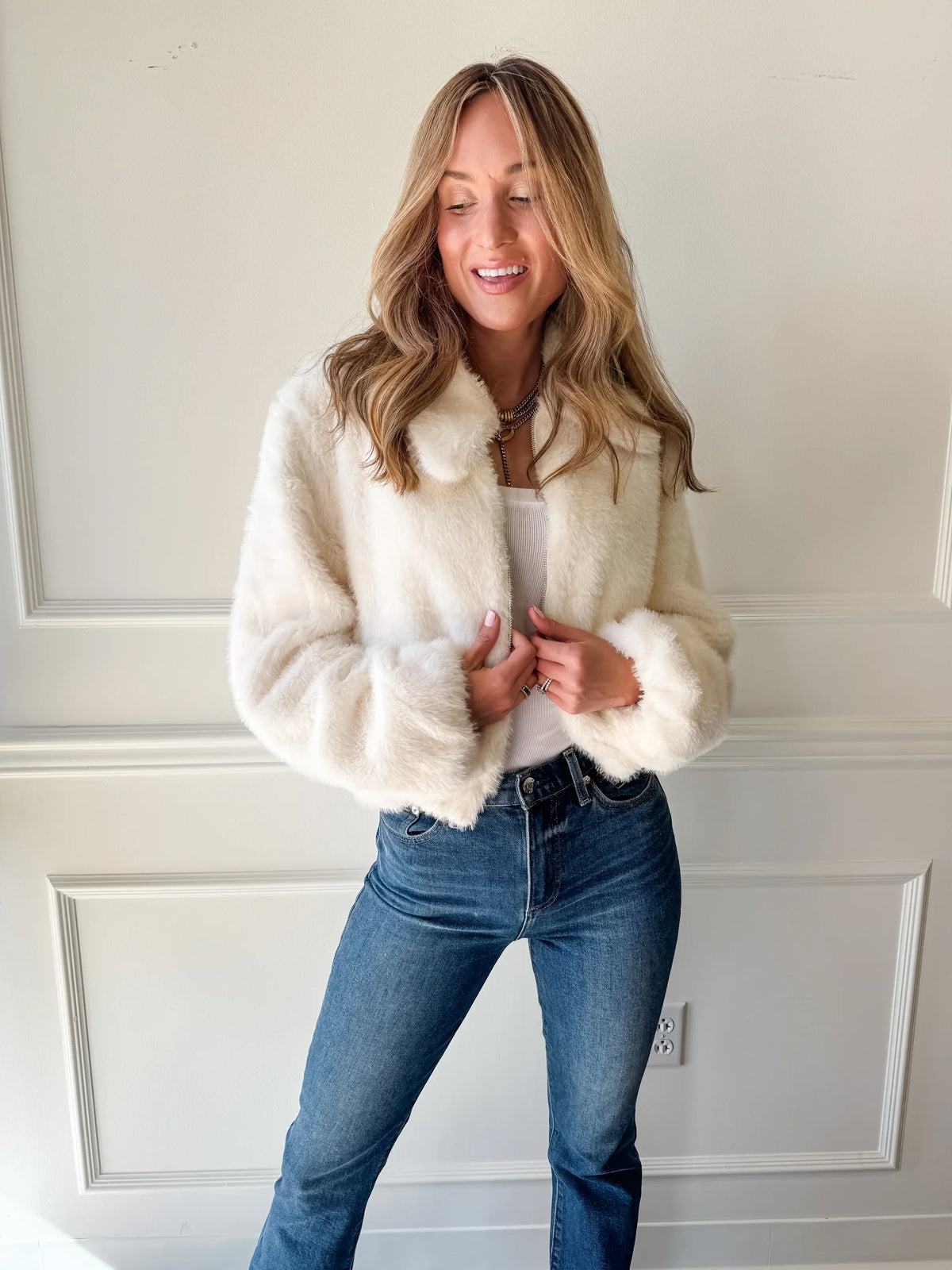 Model wearing Steve Madden Evanie faux fur coat in ivory with zipper front and soft plush texture.
