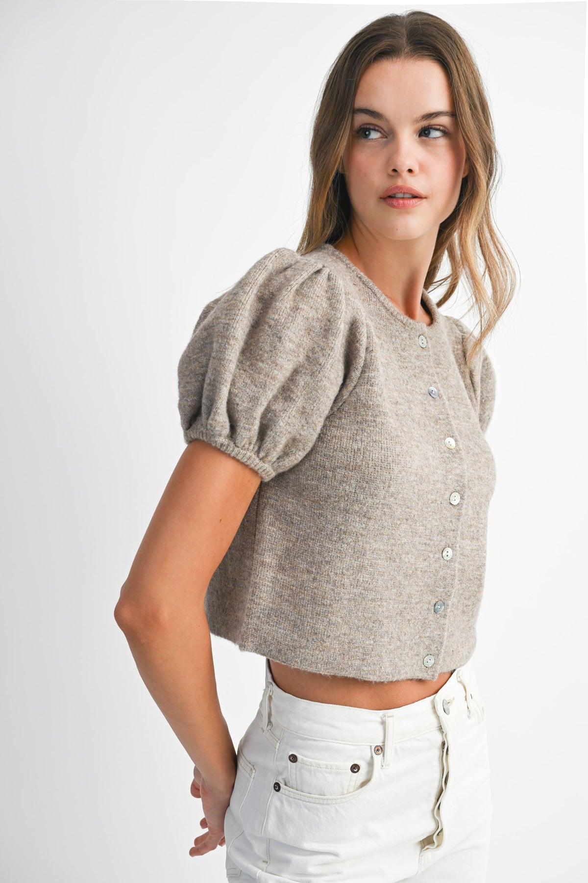Side profile of Shanty Sweater in beige knit showing soft texture and feminine puff sleeves.