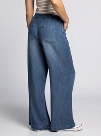 Back view of Thread & Supply Austin Pants in Sarah Wash — featuring elastic waistband and functional back pockets.