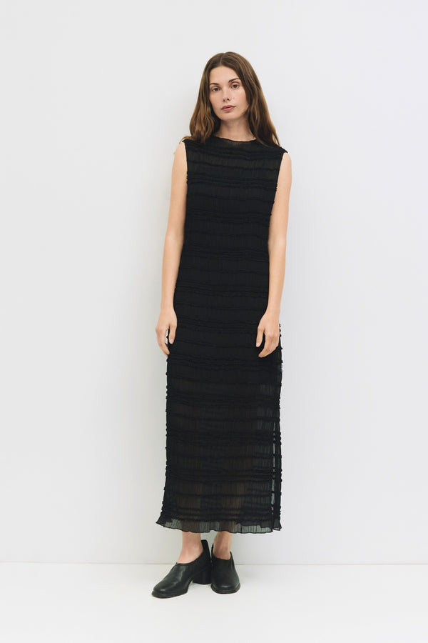Model wearing black textured sleeveless maxi dress from Shop Reverie Co.