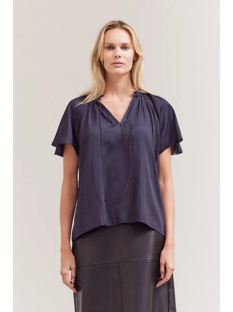 Blake Ruffle Sleeve Blouse front view — feminine flutter ruffle sleeves and draped fit in soft fabric