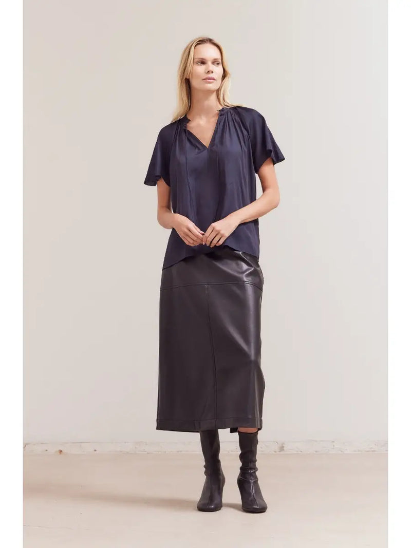 Blake Ruffle Sleeve Blouse styled with denim and accessories — versatile romantic top.