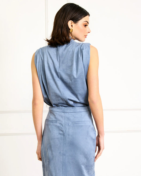 Back view of soft satin blue sleeveless top showing clean modern lines
