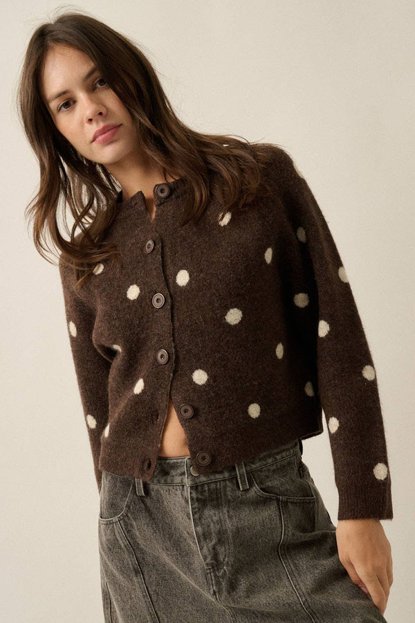 Front view of women’s chocolate brown button-front cardigan with cream polka dots