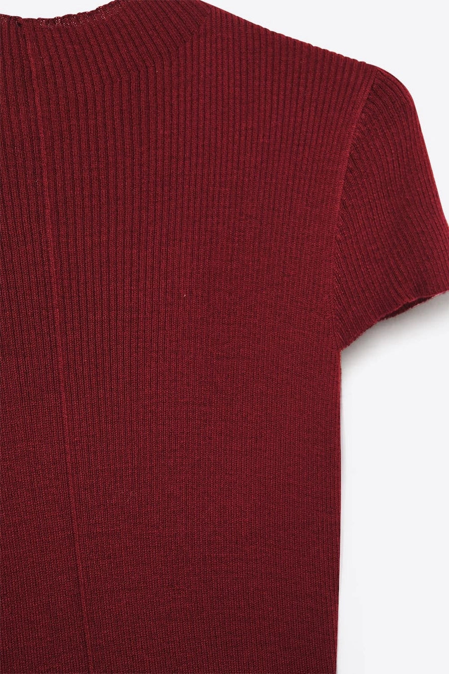 fitted wine cap sleeve knit top styled with jewelry and denim.