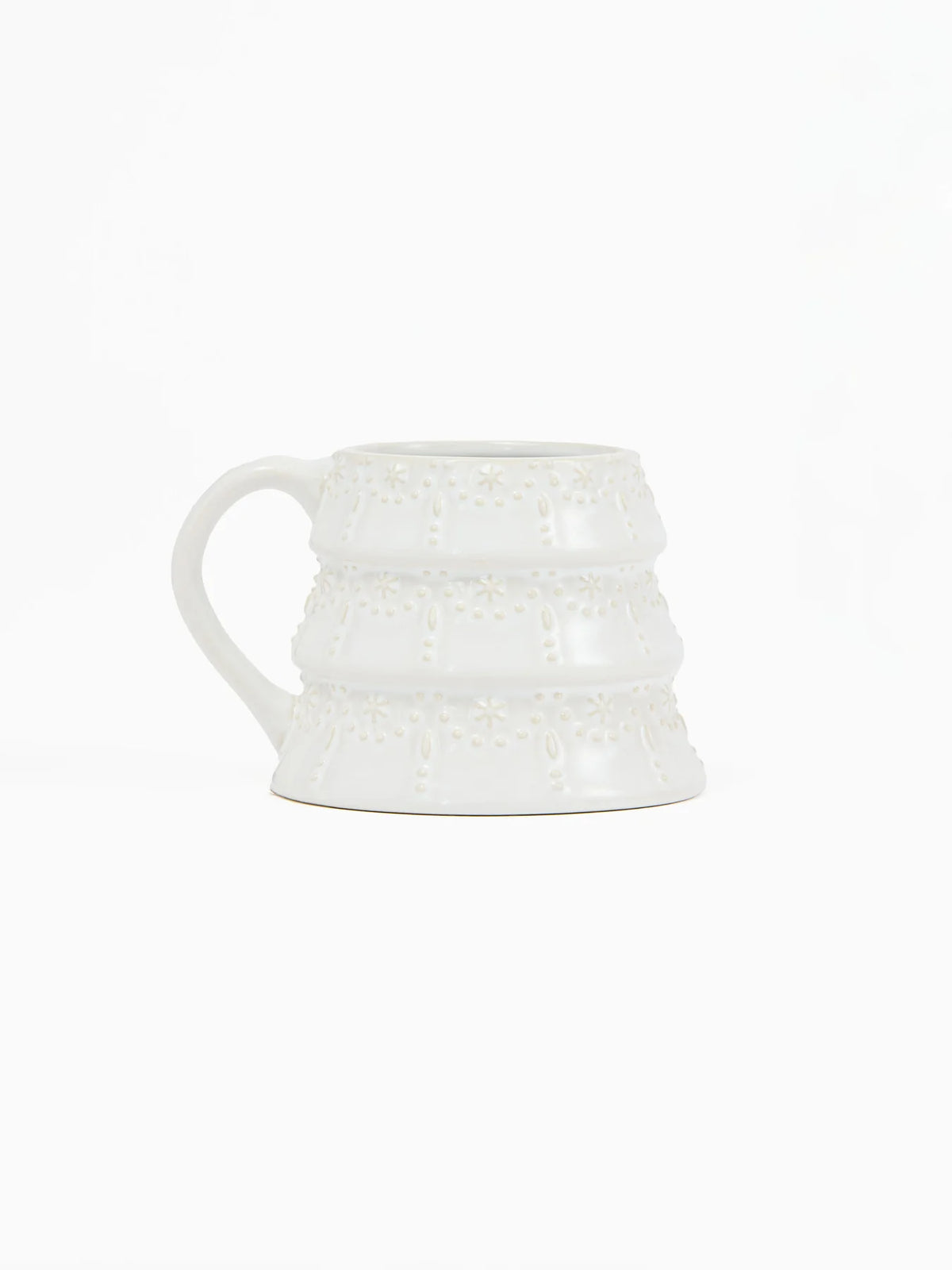 Festive ceramic holiday mug with embossed tree design and milk glaze finish from Shop Reverie Co.