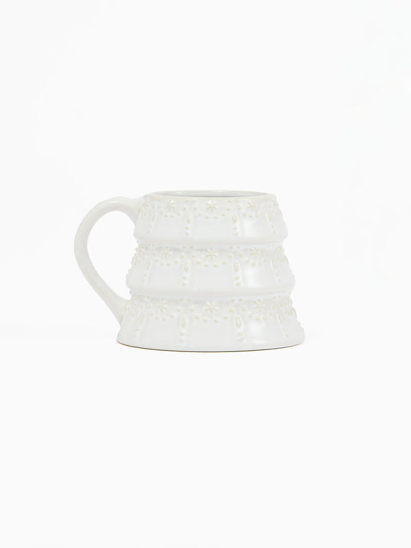 Festive ceramic holiday mug with embossed tree design and milk glaze finish from Shop Reverie Co.