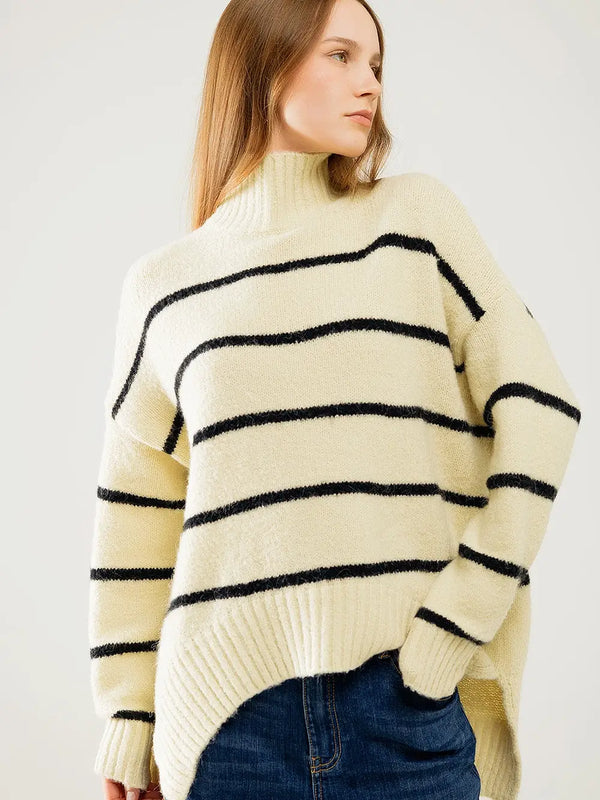 Model wearing cream and black striped oversized sweater with mock neck from Shop Reverie Co.