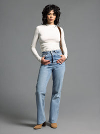 Full outfit with cream ruched top and light denim jeans for an elevated everyday style.