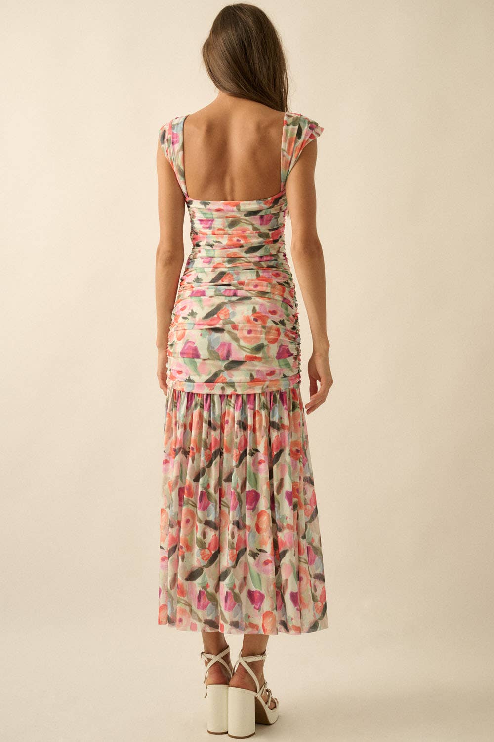 Side profile of the floral mesh maxi dress highlighting the trend-forward drop-waist and ruched fabric texture.