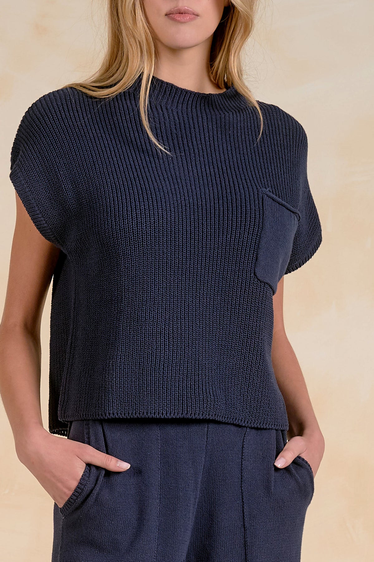 Close-up of Elan SW11480 navy knit sweater top with crew neck, ribbed texture and chest pocket