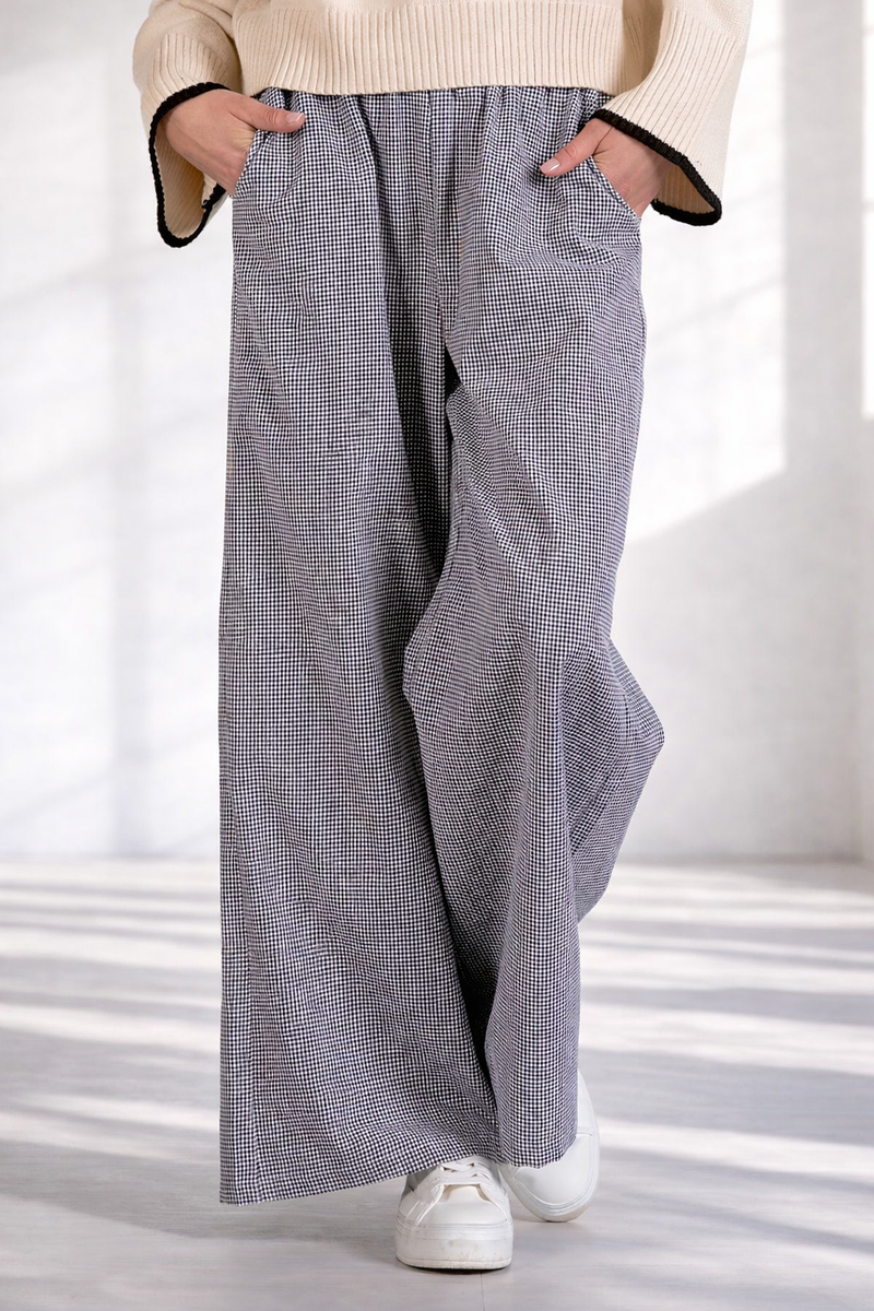 Close-up detail of women's gingham wide leg pants with side pockets