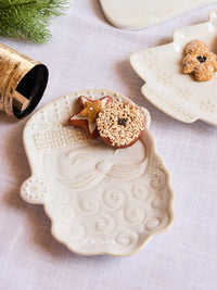 Holiday appetizer plate featuring Santa face design from Mary Square collection.