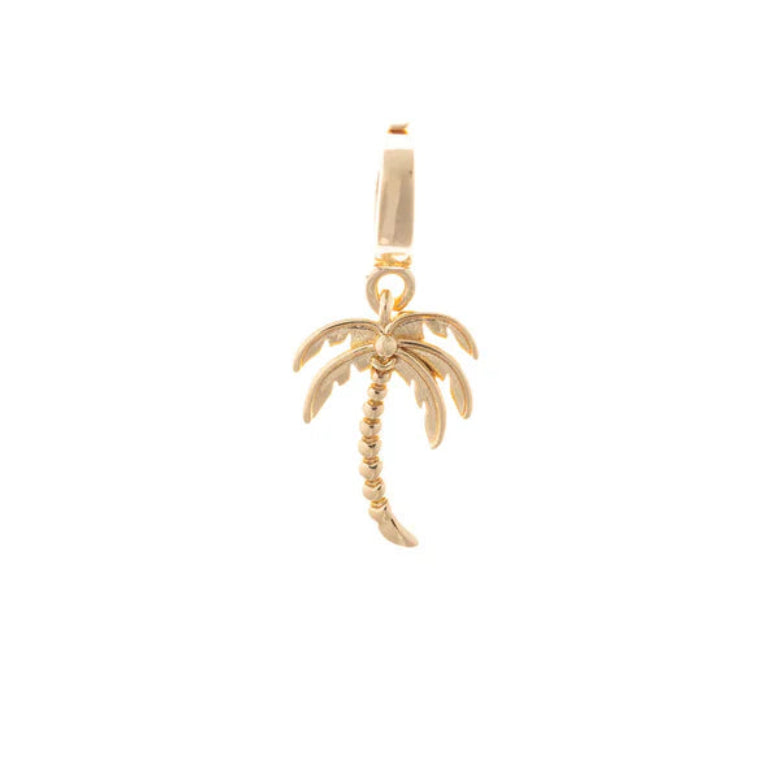Close-up of the Michelle McDowell gold palm tree symbol charm, perfect for adding a tropical touch to your custom jewelry.