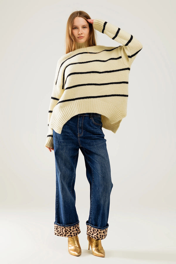 Front view of cream and black striped knit sweater, relaxed fit boutique outfit.