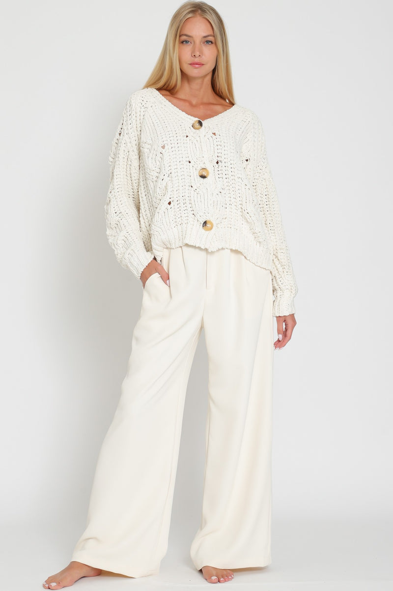 model wearing cream cardigan and cream pants