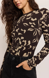Close Up View of women in brown floral long sleeve top
