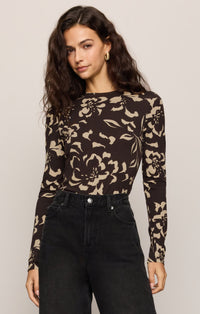 Front View of women in brown floral long sleeve top