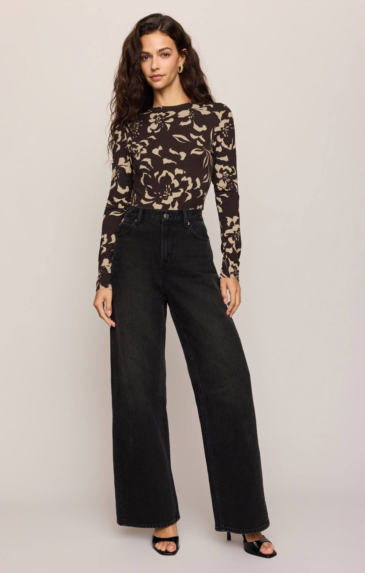 Full View of women in brown floral long sleeve top