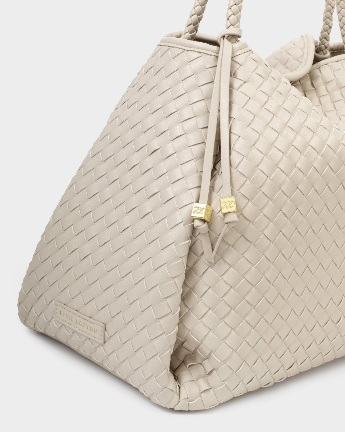 Oyster woven vegan leather tote bag close-up with gold hardware
