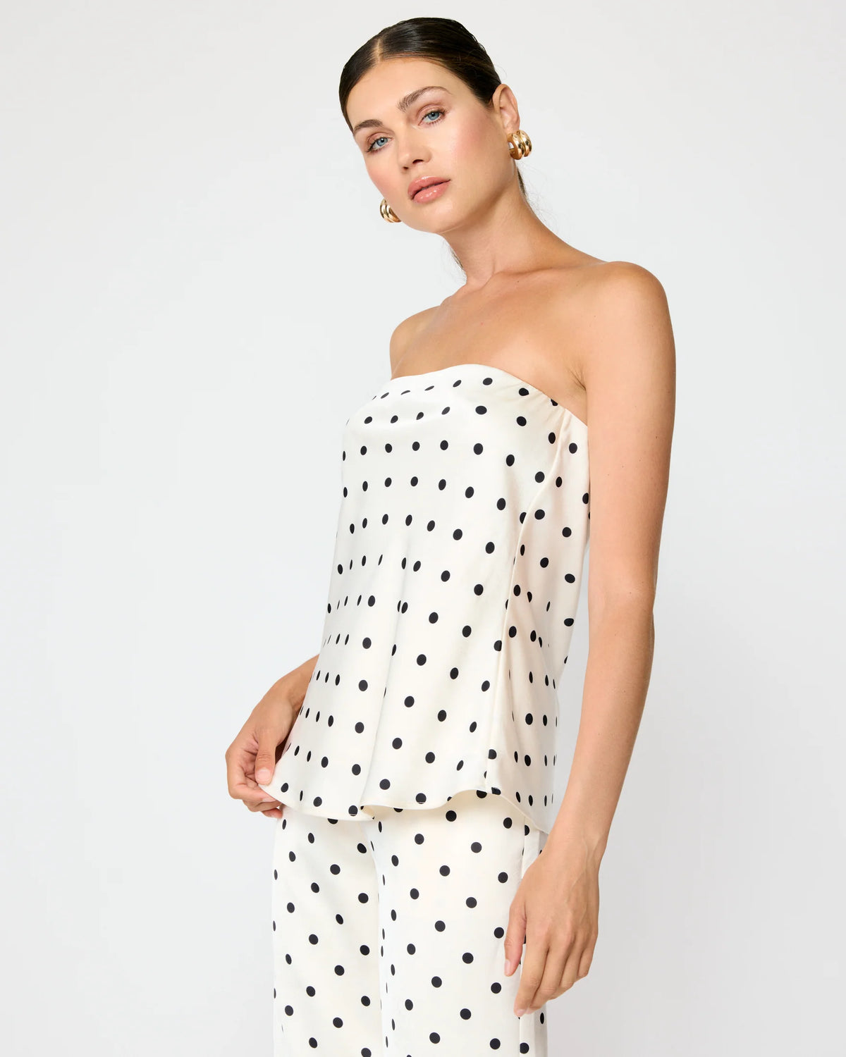 close up polka dot satin fabric strapless tube top detail