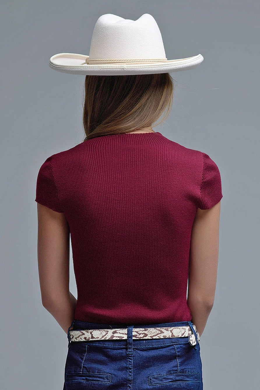 Back view of ribbed wine red knit top showing fitted silhouette and short sleeves