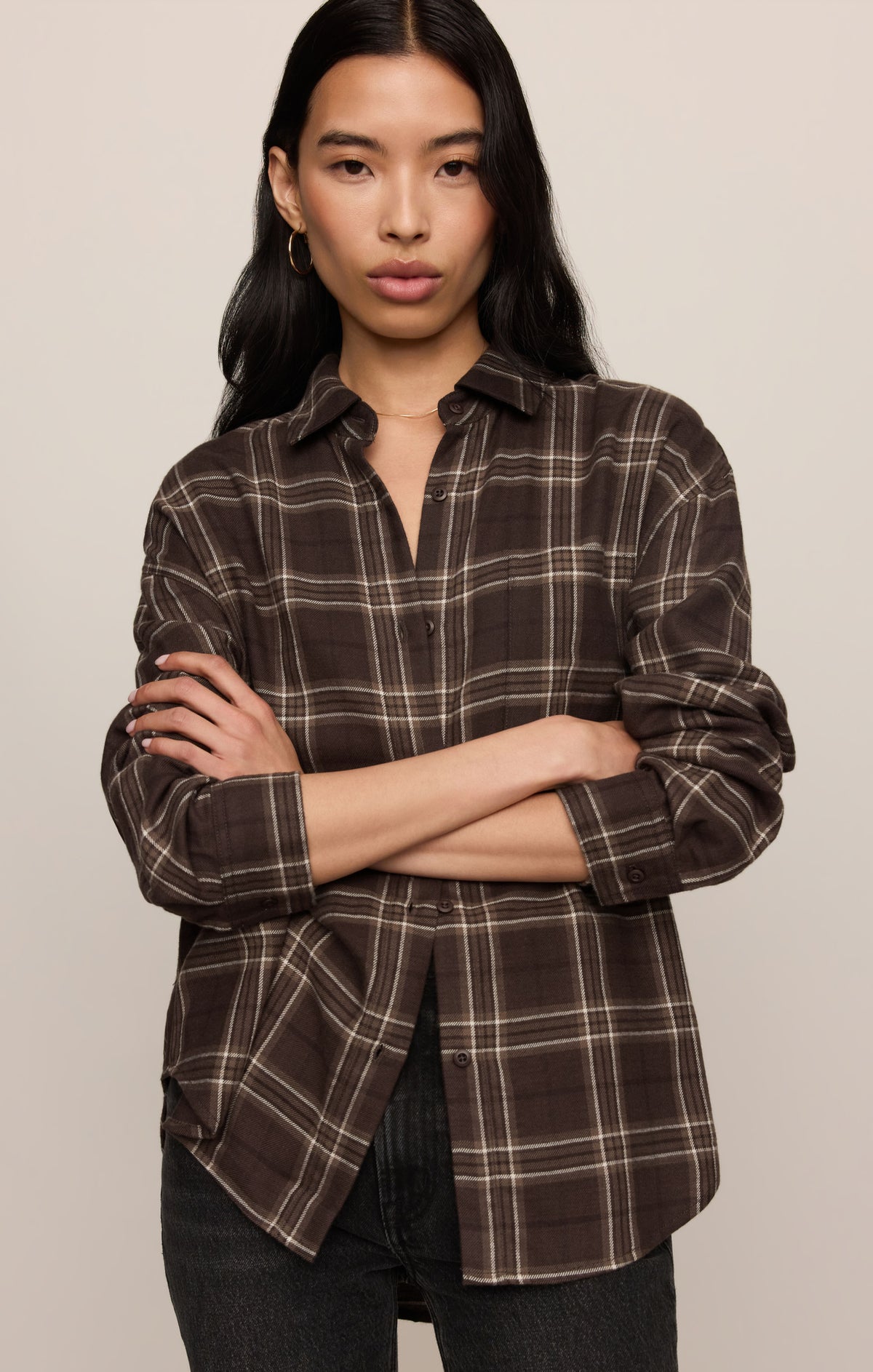 River Plaid Button Up in Dark Roast, front view with arms crossed showing the brown-and-cream plaid — women's flannel button up shirt