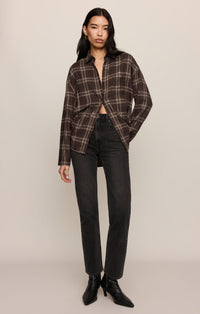River Plaid Button Up in Dark Roast, cropped detail of the untucked curved hem over dark jeans — women's lightweight plaid flannel shirt