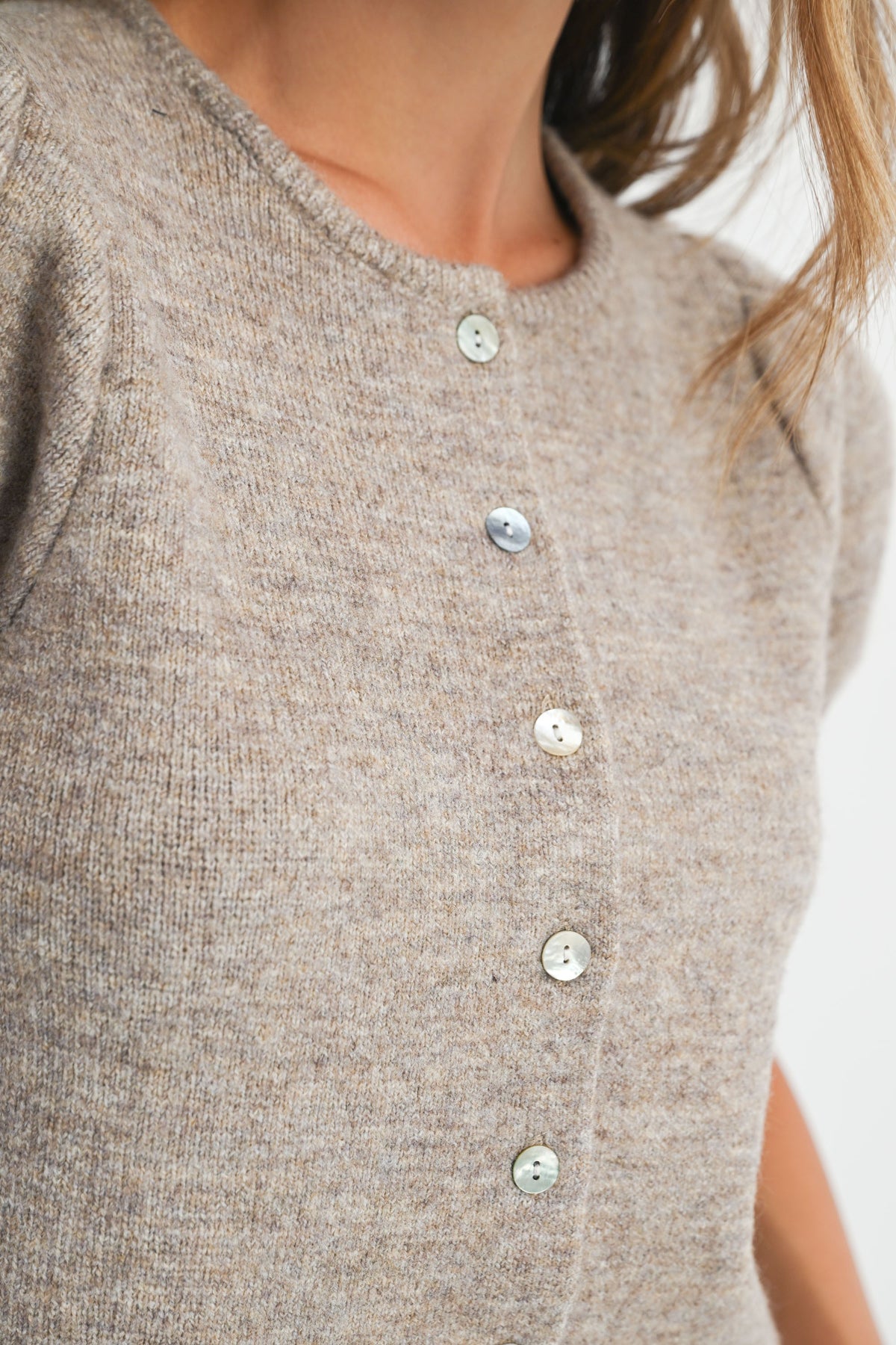 Close-up of Shanty Sweater button-down front and knit fabric texture.