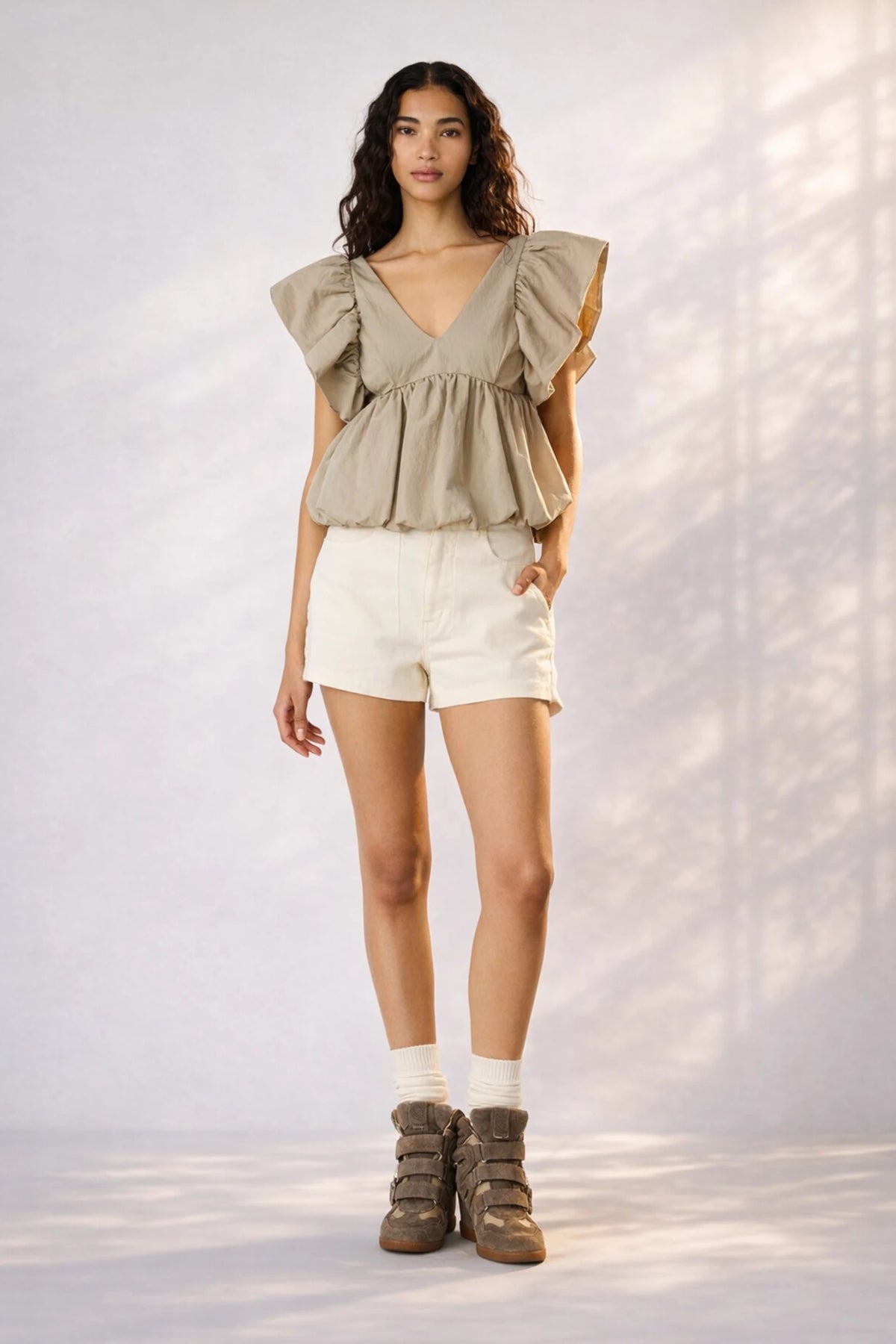 Model wearing Steve Madden Saskya blouse khaki styled with shorts full body outfit