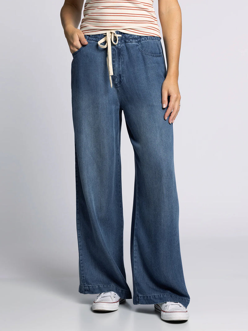 Front view of Thread & Supply Austin Pants featuring wide-leg silhouette, soft denim texture, and adjustable drawstring waistband.