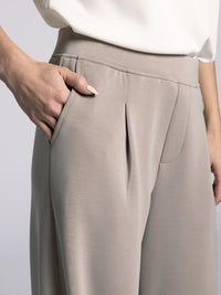 Side angle of Thread & Supply Soft Trouser Pants in Taupe showing flowy fabric and elegant relaxed cut.