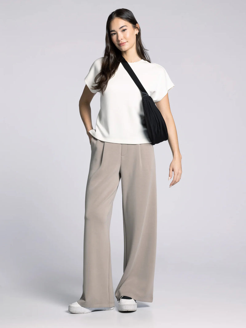 Model wearing Thread & Supply Soft Trouser Pants in Taupe — wide-leg lounge trousers with a relaxed fit and minimalist design.