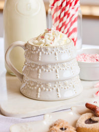 White Tree Christmas Mug by Mary Square filled with whipped cream and peppermint, styled with milk and cookies.