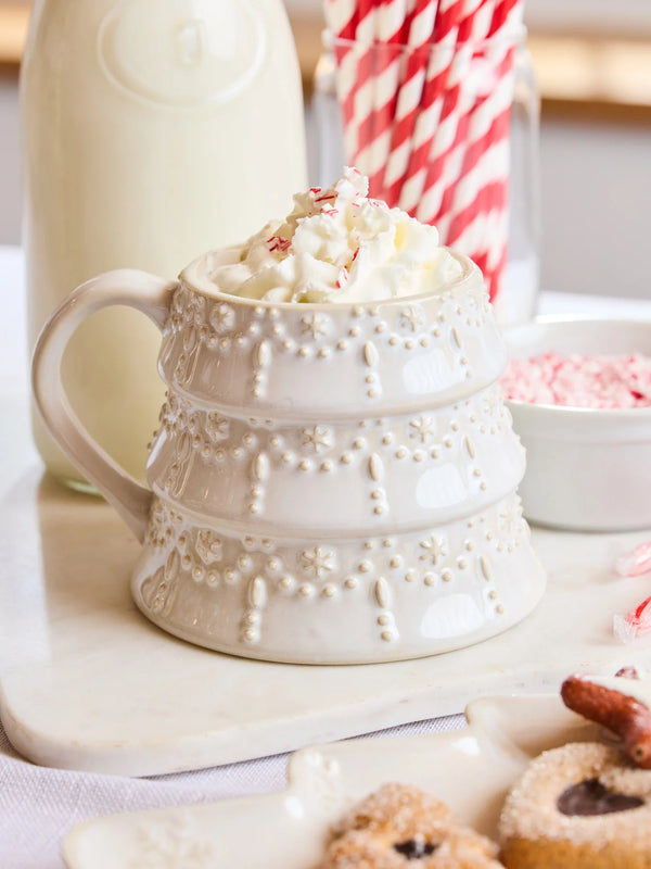 White Tree Christmas Mug by Mary Square filled with whipped cream and peppermint, styled with milk and cookies.